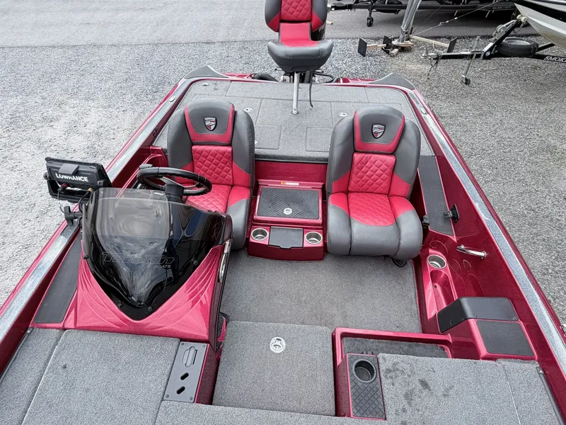 Slide: The Image of Interior of a 2017 Triton 19 TrX boat with red and gray seats. - 6