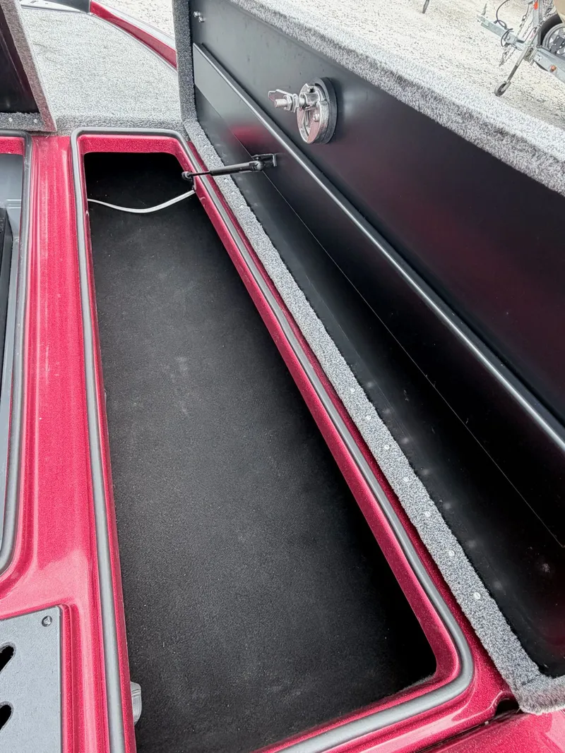 Slide: The Image of Interior of a 2017 Triton 19 TrX boat with storage compartment. - 7