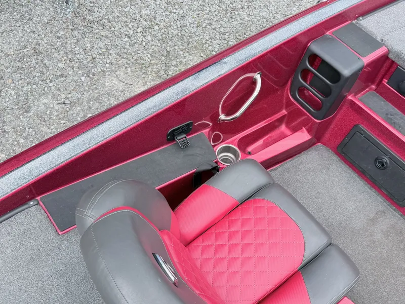 Slide: The Image of Interior of a 2017 Triton 19 TrX boat with red seats. - 9