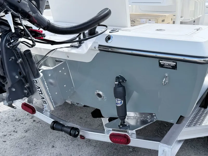 Slide: The Image of Skeeter SX221 2026 boat rear view with motor and trailer. - 15