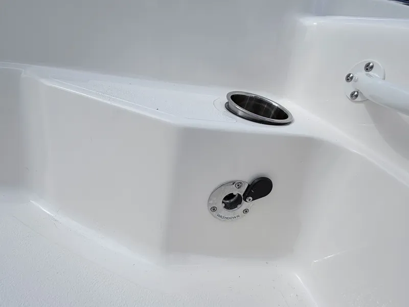 Slide: The Image of Skeeter SX221 2026 boat with washdown fitting and cup holder. - 16