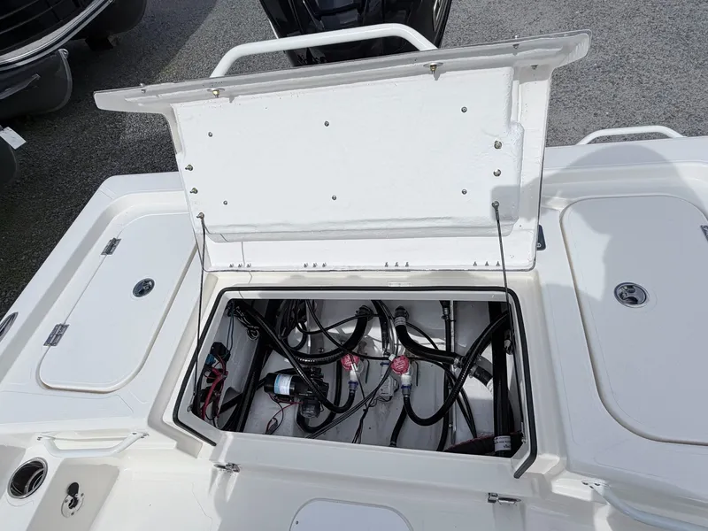 Slide: The Image of Open storage compartment in Skeeter SX221 boat, model 2026. - 17