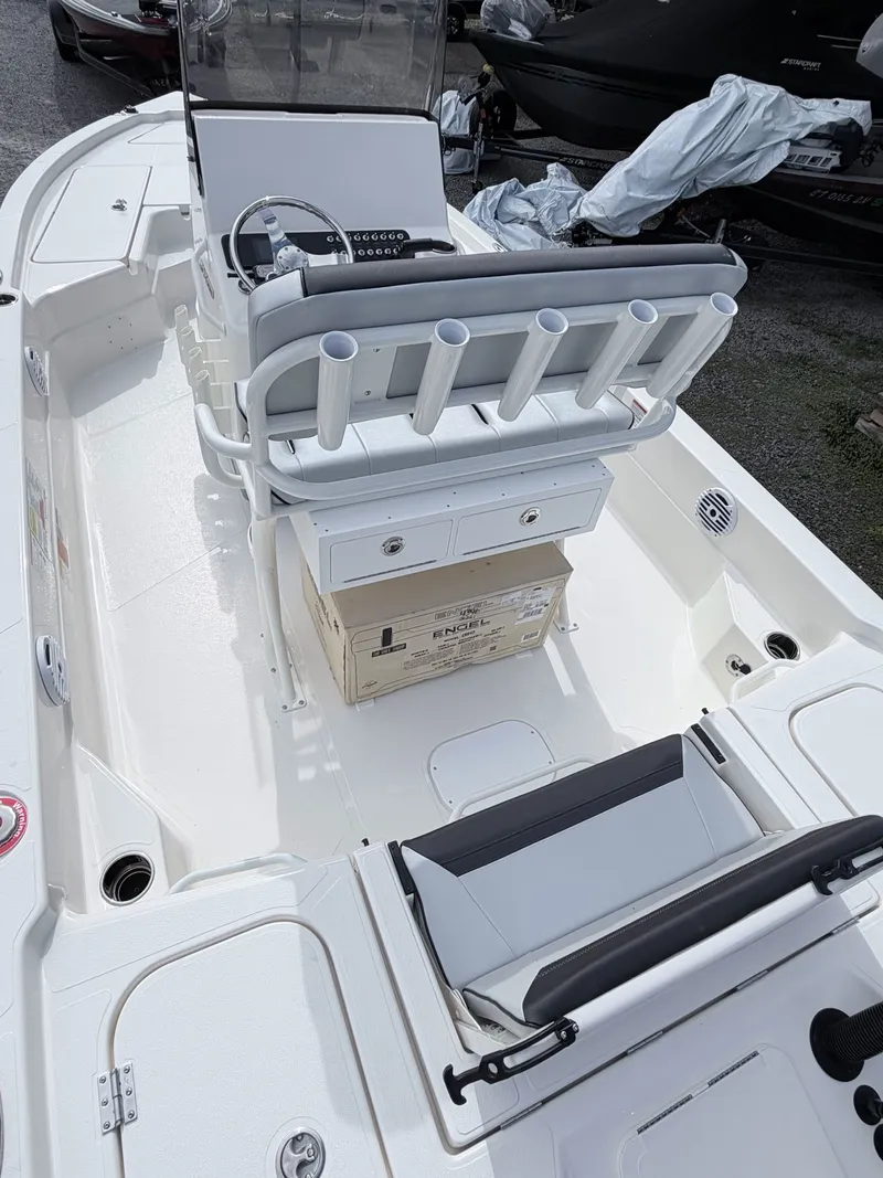 Slide: The Image of Interior view of 2026 Skeeter SX221 boat with fishing rod holders. - 18