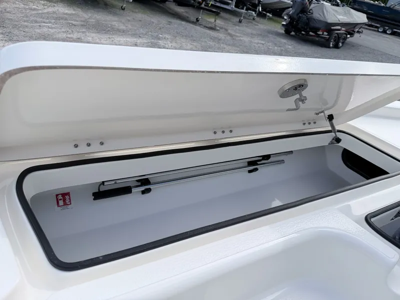 Slide: The Image of Open storage compartment in Skeeter SX221 boat, model year 2026. - 24