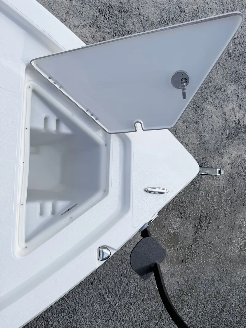 Slide: The Image of Open storage compartment on a 2026 Skeeter SX221 boat. - 25
