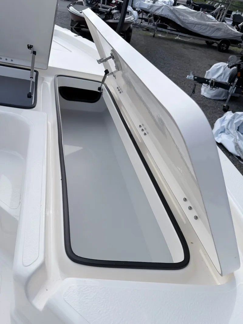 Slide: The Image of Open storage compartment in Skeeter SX221 boat, model 2026. - 36