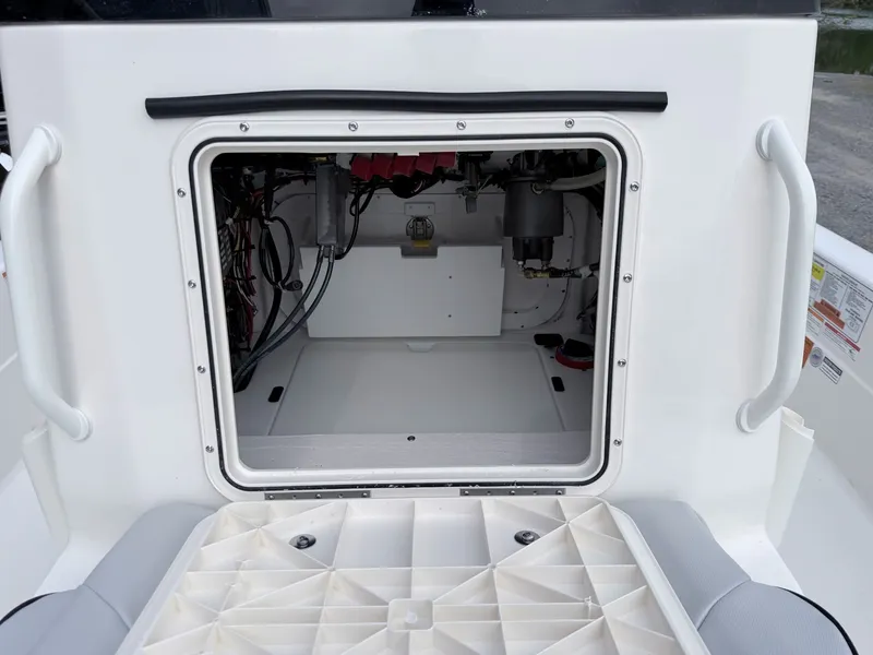 Slide: The Image of Interior view of 2026 Skeeter SX221 boat engine compartment. - 39