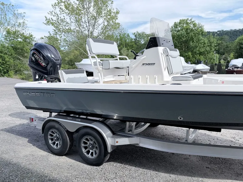 Slide: The Image of 2026 Skeeter SX221 boat parked on trailer outdoors. - 43