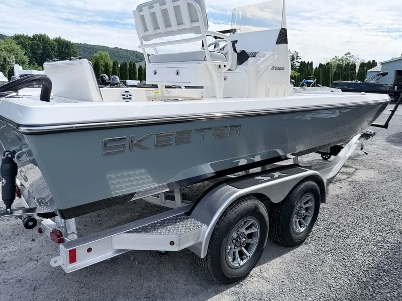Slide: The Image of 2026 Skeeter SX221 boat on trailer, side view. - 46