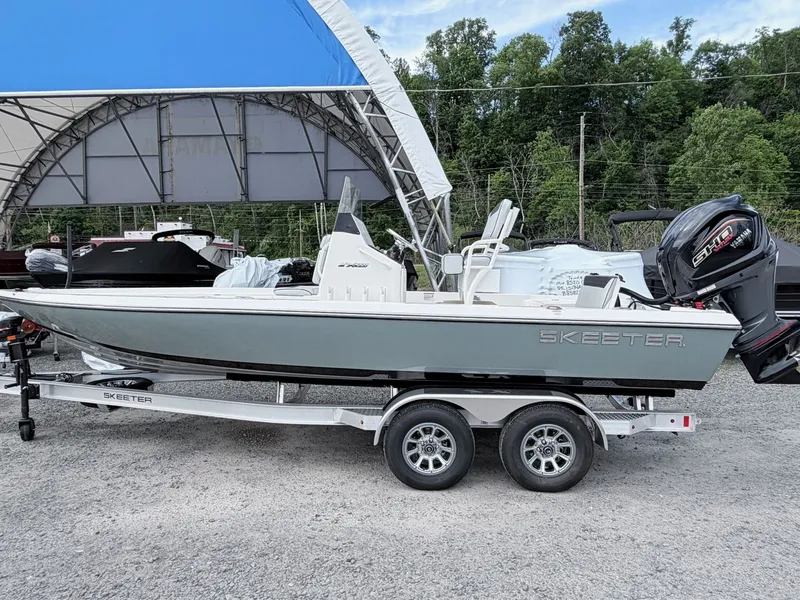 Slide: The Image of 2026 Skeeter SX221 boat parked on trailer outdoors. - 47