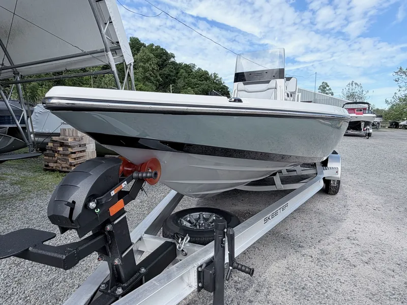 Slide: The Image of 2026 Skeeter SX221 boat on trailer, side view. - 7
