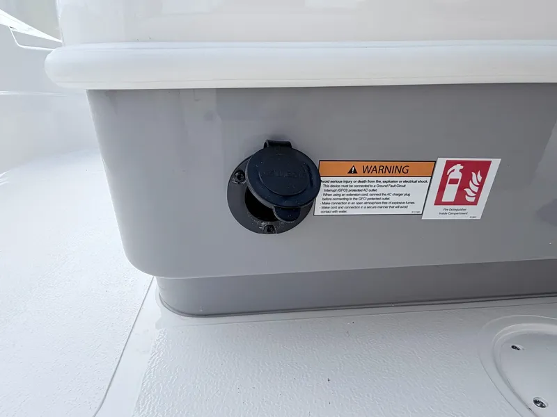 Slide: The Image of Skeeter SX221 2026 boat with warning label and fire extinguisher symbol. - 8