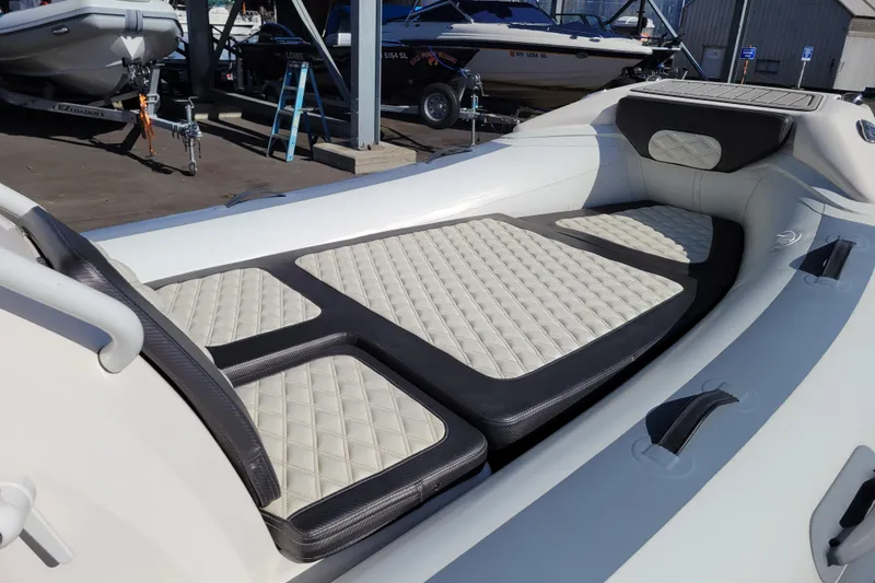 Slide: The Image of 2022 Highfield Sport 460 boat interior with quilted seating and sleek design. - 13
