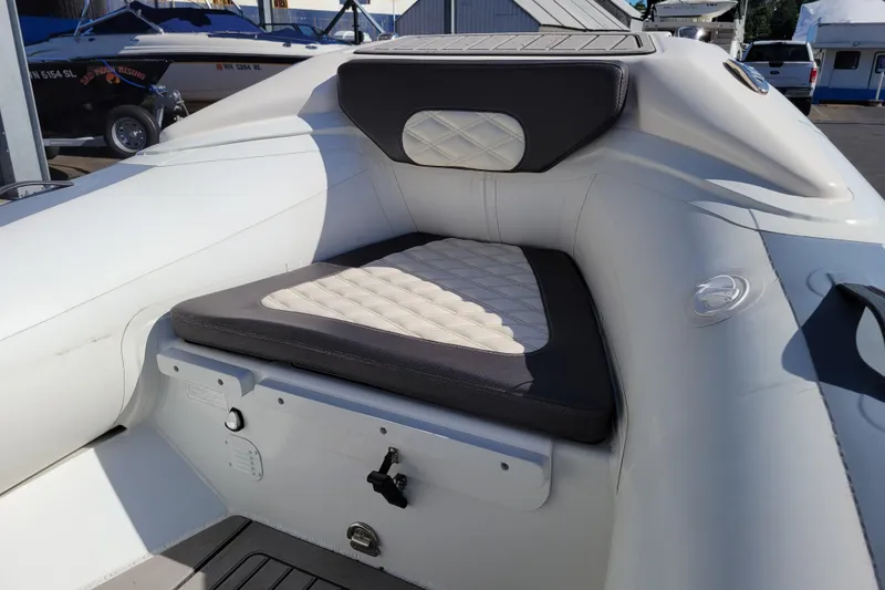 Slide: The Image of 2022 Highfield Sport 460 boat interior with cushioned seating and sleek design. - 18