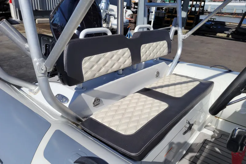 Slide: The Image of Highfield Sport 460 boat interior, 2022 model, featuring diamond-stitched seating and sturdy frame. - 8