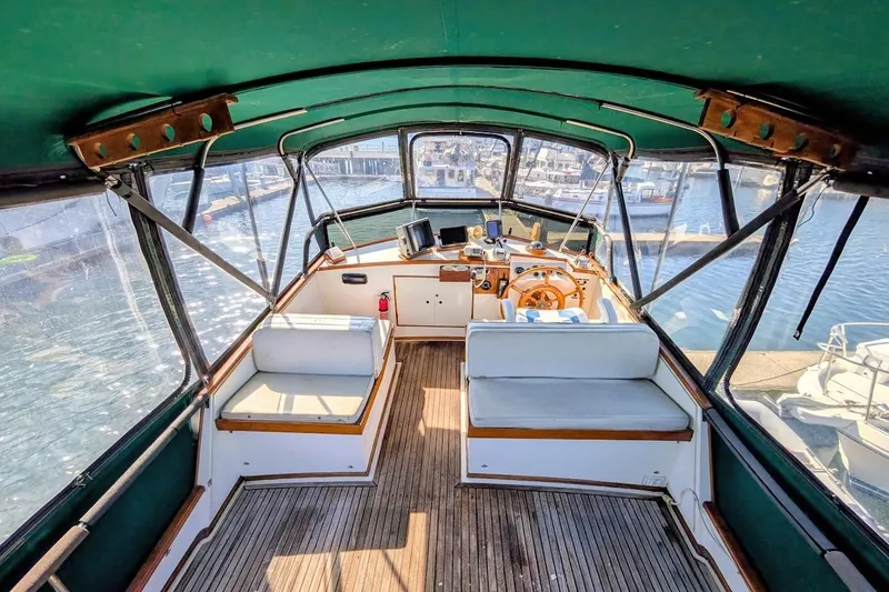 Slide: The Image of Interior view of 1979 Grand Banks 42 Classic yacht with wooden helm and seating. - 11