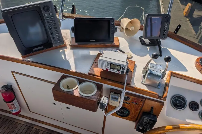 Slide: The Image of Helm of 1979 Grand Banks 42 Classic with navigation equipment and controls. - 15