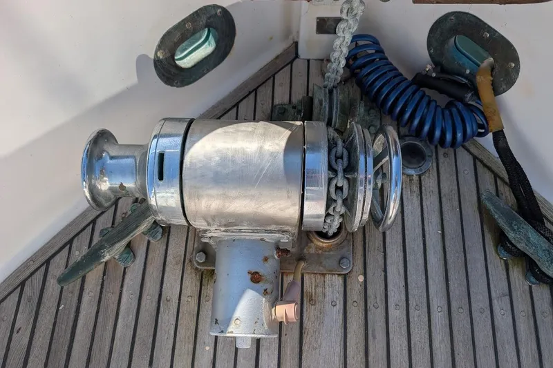 Slide: The Image of Anchor windlass on 1979 Grand Banks 42 Classic boat deck. - 27