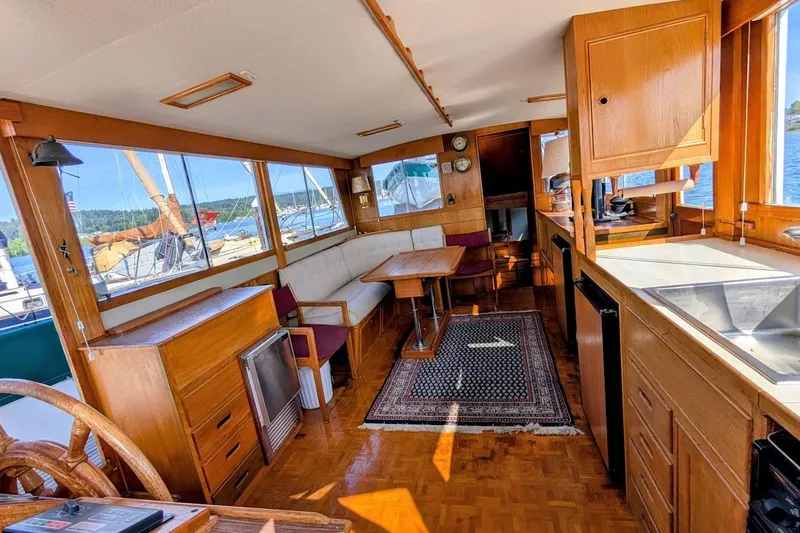 Slide: The Image of Interior of 1979 Grand Banks 42 Classic yacht with wooden furnishings and nautical decor. - 32