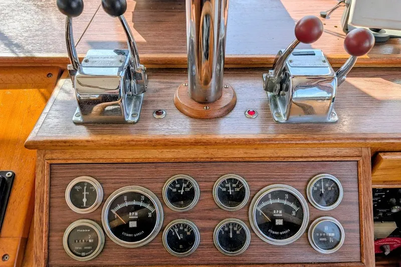 Slide: The Image of 1979 Grand Banks 42 Classic helm with throttle controls and vintage gauges. - 35