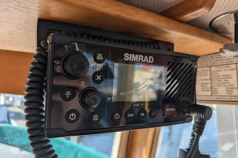 Slide: The Image of Simrad marine radio on 1979 Grand Banks 42 Classic yacht dashboard. - 39
