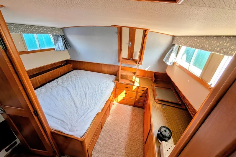 Slide: The Image of Interior cabin of a 1979 Grand Banks 42 Classic yacht with wooden furnishings. - 42