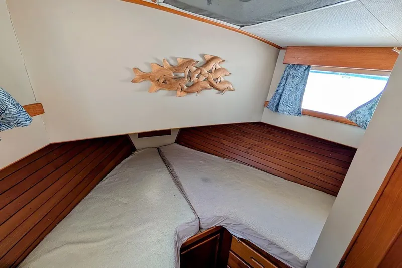 Slide: The Image of Cozy cabin interior of 1979 Grand Banks 42 Classic with wooden accents and nautical decor. - 47