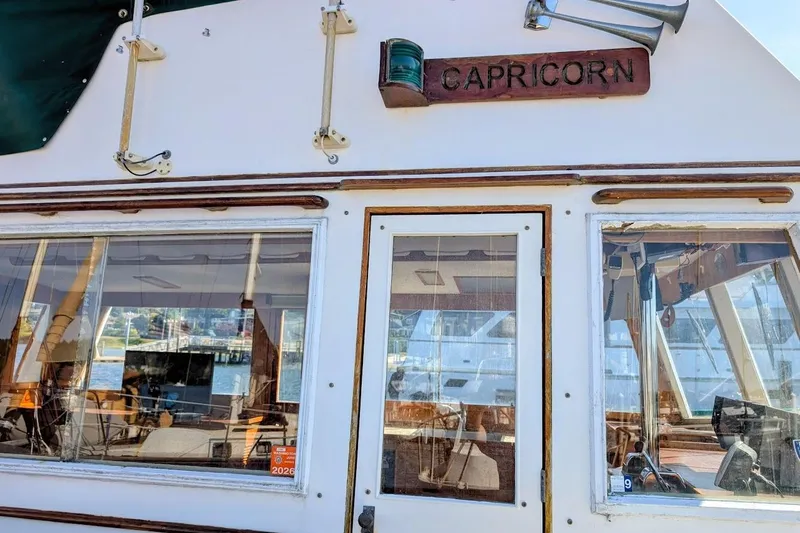 Slide: The Image of 1979 Grand Banks 42 Classic boat named Capricorn, featuring wooden trim and large windows. - 7