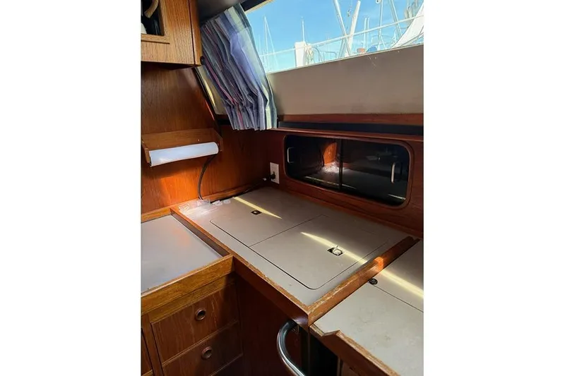 Slide: The Image of 1982 C&C Landfall 38 yacht interior with wooden cabinetry and countertop. - 11