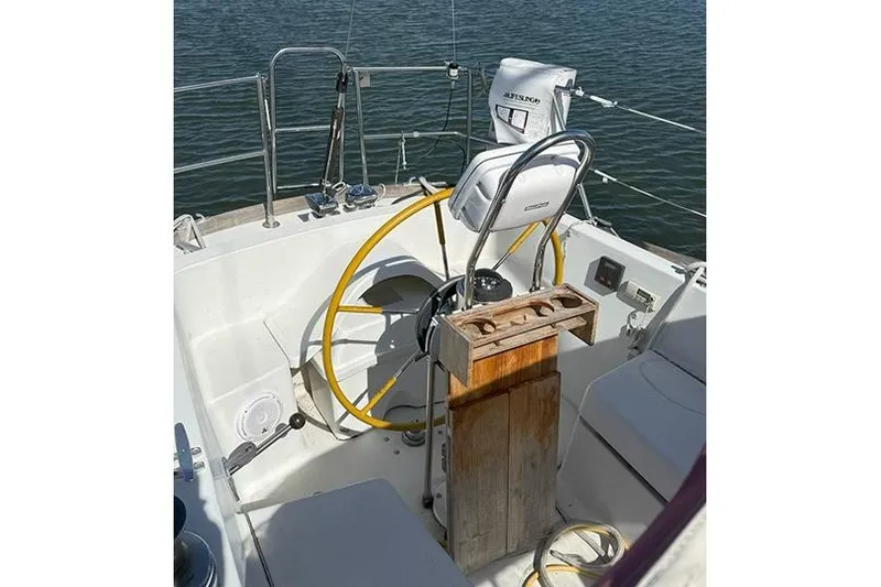 Slide: The Image of Cockpit of 1982 C&C Landfall 38 sailboat with steering wheel and seating. - 4