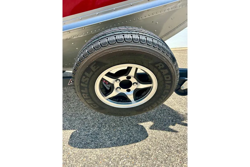 Slide: The Image of 2019 Alumacraft Classic 165 Sport trailer tire with Carlisle radial branding. - 24