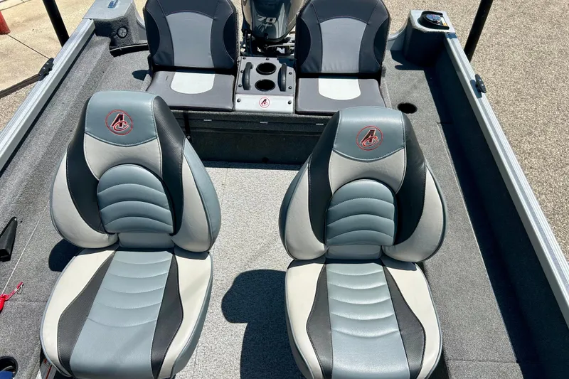 Slide: The Image of 2019 Alumacraft Classic 165 Sport boat interior with stylish seating and motor. - 33