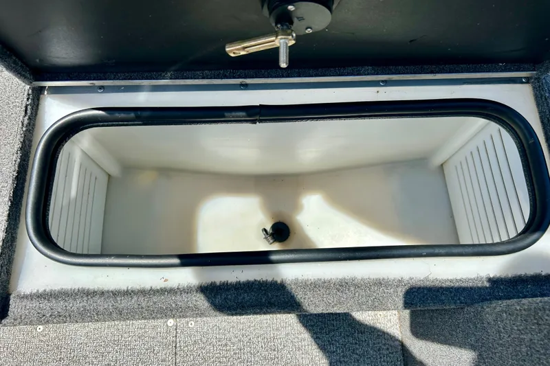 Slide: The Image of 2019 Alumacraft Classic 165 Sport boat storage compartment, open and empty. - 42