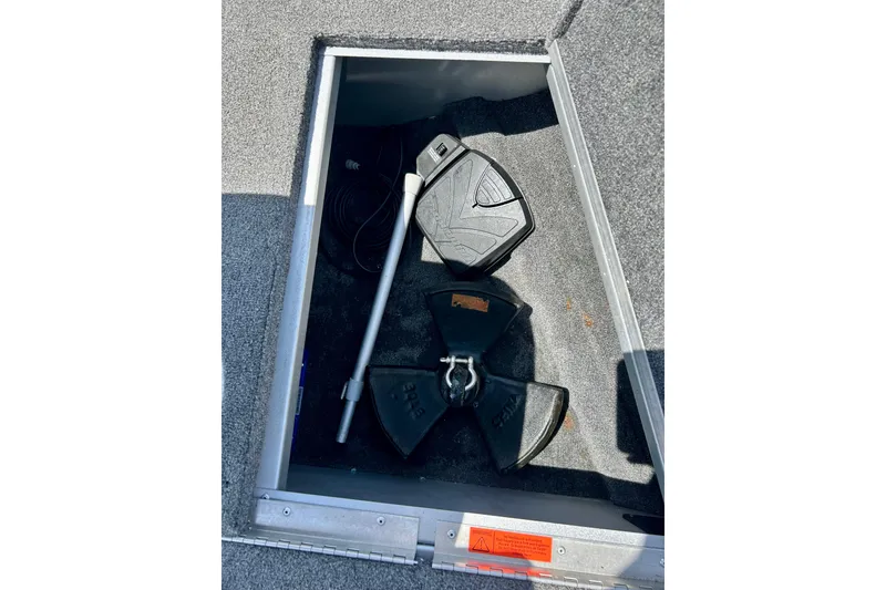Slide: The Image of Storage compartment in a 2019 Alumacraft Classic 165 Sport boat with anchor and accessories. - 46