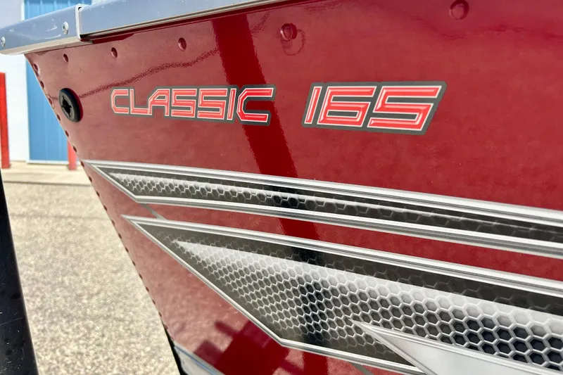 Slide: The Image of Red 2019 Alumacraft Classic 165 Sport boat with sleek graphics and bold lettering. - 8