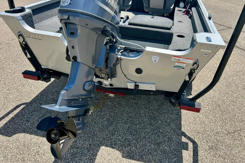 Slide: The Image of 2019 Alumacraft Classic 165 Sport boat with Yamaha outboard motor, rear view. - 9