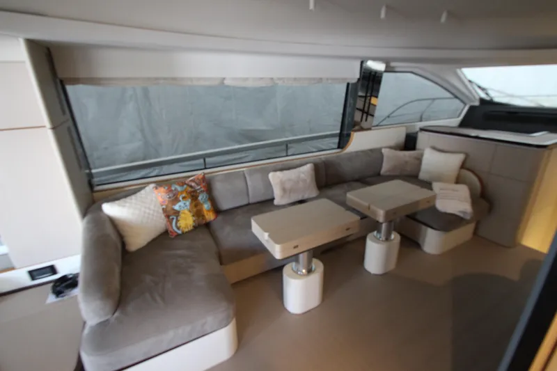 Slide: The Image of Luxurious interior of 2023 Azimut Fly 68 yacht with plush seating and modern decor. - 18