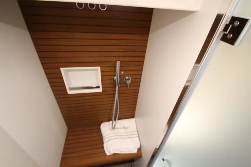 Slide: The Image of Luxurious shower area in 2023 Azimut Fly 68 yacht with wooden accents and modern fixtures. - 74