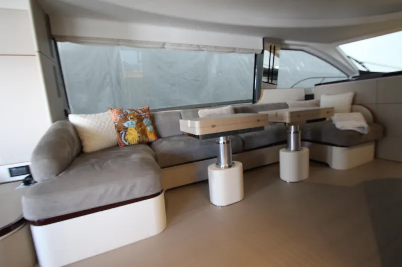 Slide: The Image of Luxurious interior of 2023 Azimut Fly 68 yacht with plush seating and modern decor. - 19
