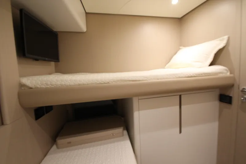 Slide: The Image of 2023 Azimut Fly 68 yacht interior with bunk bed and TV. - 38