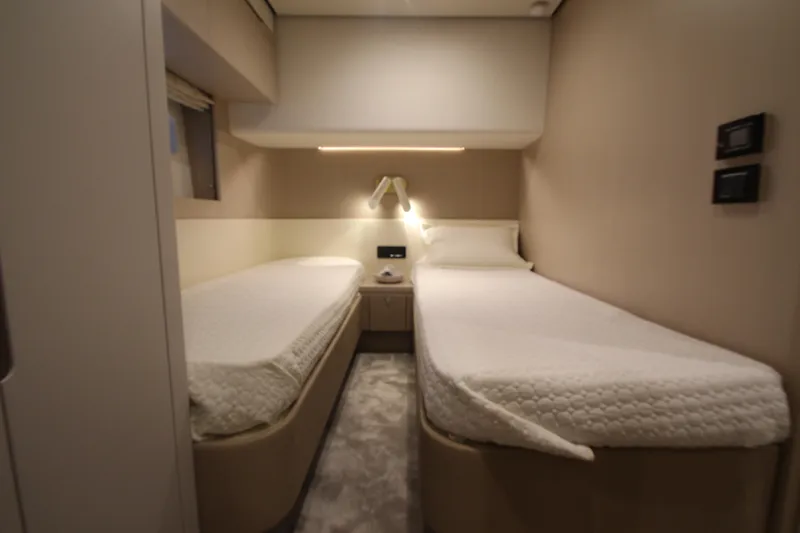Slide: The Image of Interior of 2023 Azimut Fly 68 yacht cabin with twin beds and modern decor. - 42