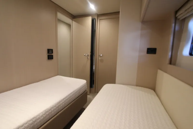Slide: The Image of Interior of 2023 Azimut Fly 68 yacht cabin with twin beds and modern design. - 45