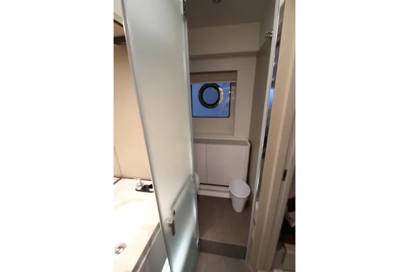 Slide: The Image of Modern bathroom interior of 2023 Azimut Fly 68 yacht with frosted glass door. - 75
