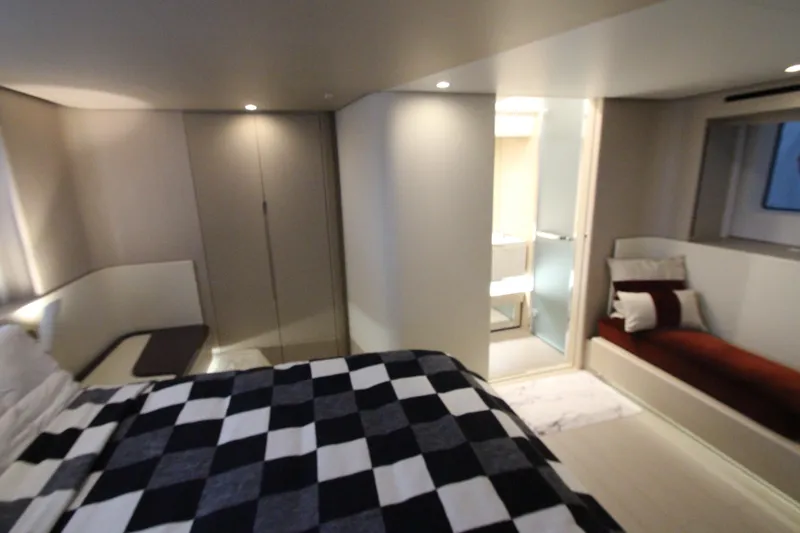 Slide: The Image of Luxurious bedroom interior of 2023 Azimut Fly 68 yacht with modern design and elegant furnishings. - 70