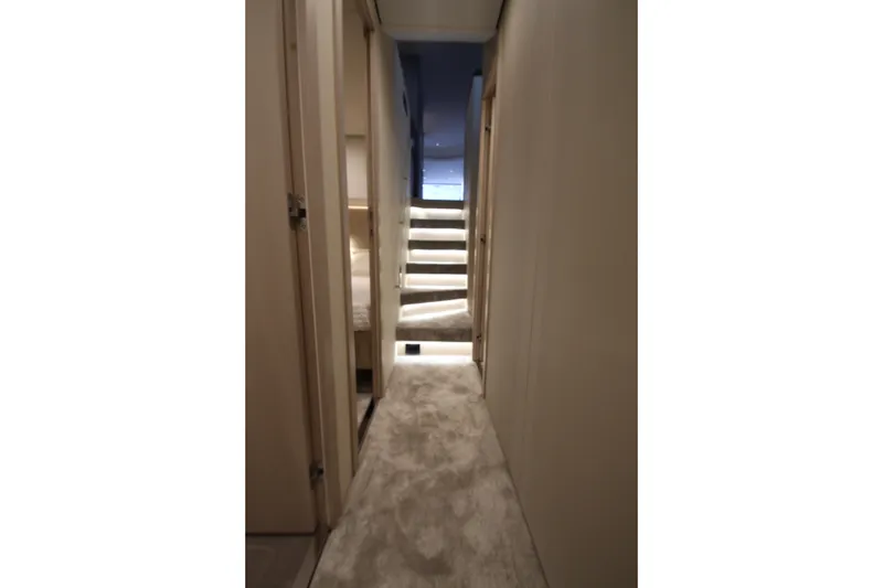 Slide: The Image of Luxurious interior hallway of 2023 Azimut Fly 68 yacht with plush carpeting and modern design. - 58