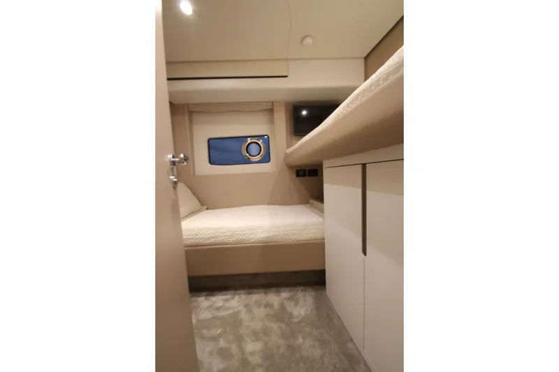 Slide: The Image of Interior cabin of 2023 Azimut Fly 68 yacht, featuring a cozy bed and modern design. - 36