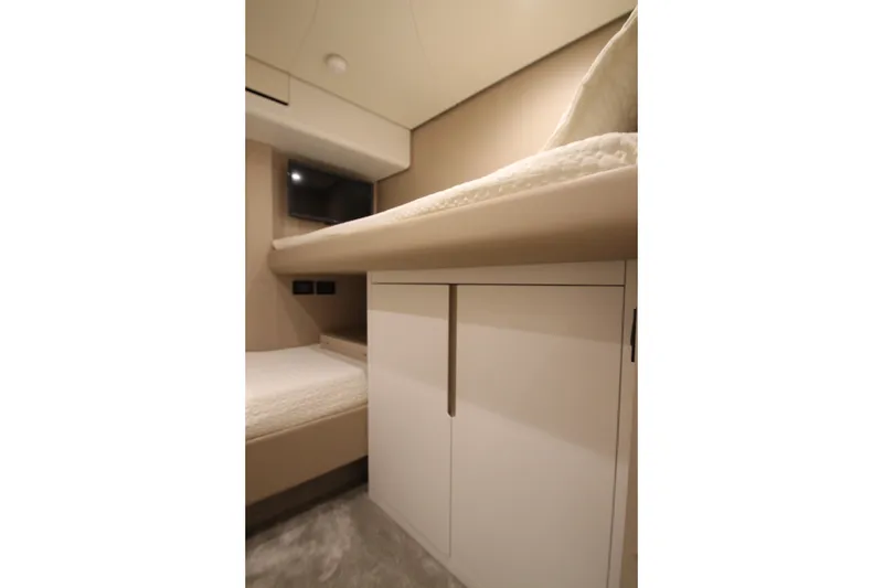 Slide: The Image of Luxurious interior cabin of 2023 Azimut Fly 68 yacht, featuring modern design and cozy bedding. - 40