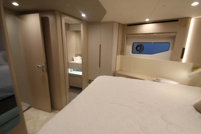 Slide: The Image of Luxurious interior of 2023 Azimut Fly 68 yacht cabin with modern design and cozy ambiance. - 52