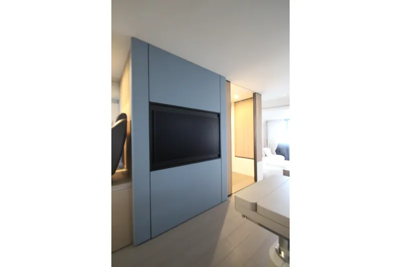 Slide: The Image of Modern interior of 2023 Azimut Fly 68 yacht with sleek design and built-in TV. - 26