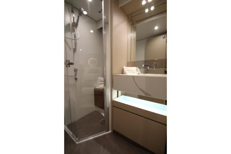 Slide: The Image of Luxurious bathroom in 2023 Azimut Fly 68 yacht with modern shower and vanity. - 57